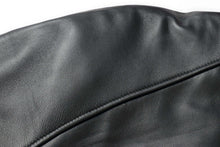 Load image into Gallery viewer, Close-up of black lamb leather material used in REED's 34'' Raglan Car Coat with zip-out lining, showcasing its soft, durable texture.