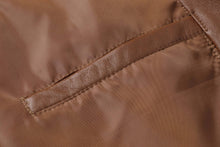 Load image into Gallery viewer, Close-up of REED Men's Premium Lambskin Leather Blazer showcasing the soft durable leather texture and stitching details.