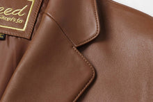 Load image into Gallery viewer, Close-up of REED Men's Premium Lambskin Leather Blazer showcasing the fine stitching and luxurious brown leather texture.