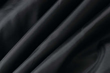 Load image into Gallery viewer, Close-up of smooth, black lambskin leather texture showcasing softness and quality