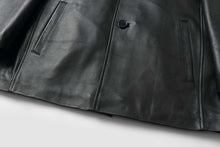 Load image into Gallery viewer, Close-up of REED EST. 1950 men's lambskin leather jacket, showcasing button closure and soft, classic car coat design.