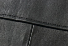 Load image into Gallery viewer, Close-up of genuine lambskin leather texture from REED EST. 1950 men's jacket, showing fine stitching and soft material.