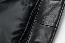 Load image into Gallery viewer, Close-up of black genuine lambskin leather jacket showing texture and zip lining detail.