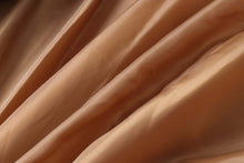 Load image into Gallery viewer, Close-up of soft, supple satin fabric in light brown shade, showcasing texture and smoothness.