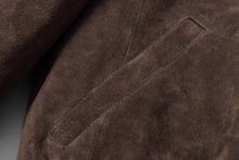 Load image into Gallery viewer, Close-up of REED Men's Baseball Suede Leather Jacket showcasing supple brown suede texture and precise stitching details.