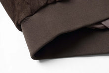 Load image into Gallery viewer, Close-up of brown ribbed cuff on REED Men's Baseball Suede Leather Jacket, featuring soft supple touch satin lining.