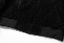 Load image into Gallery viewer, Bottom detail of REED Men's Baseball Suede Leather Jacket with black trim, showcasing soft texture and quality craftsmanship.