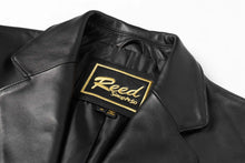 Load image into Gallery viewer, REED Men's Premium Lambskin Leather Blazer with label detail, showcasing soft-touch luxury in classic black design.