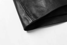 Load image into Gallery viewer, Close-up of REED Men's Premium Lambskin Leather Blazer sleeve showcasing luxurious soft-touch black leather texture.