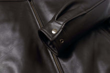 Load image into Gallery viewer, Black REED New Zealand Lambskin Leather Jacket with close-up view of zipper and cuff detailing, showcasing smooth finish and premium quality.