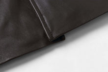 Load image into Gallery viewer, Close-up of REED EST. 1950 men's lambskin leather jacket detail showing soft, genuine leather texture and craftsmanship.