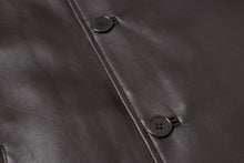 Load image into Gallery viewer, Genuine lambskin leather car coat with four button closure from REED EST. 1950, close-up on buttons and texture.