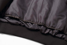 Load image into Gallery viewer, Close-up detail of REED Men's Premium Leather Aviator Bomber Jacket's interior and knit cuffs, showcasing quality materials.