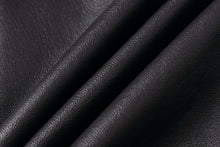Load image into Gallery viewer, Close-up of premium black leather texture used for REED Men's Aviator Bomber Jacket, highlighting durability and quality craftsmanship.