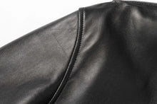 Load image into Gallery viewer, Close-up of REED Men's New Zealand black lambskin leather jacket showcasing fine stitching and luxurious material texture.