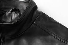 Load image into Gallery viewer, Close-up of REED men's genuine lambskin leather jacket with stand-up collar, showcasing luxury and durability. Perfect for winter wear.