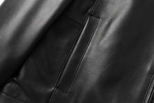 Load image into Gallery viewer, Close-up of REED men's lambskin leather jacket detail showcasing luxurious texture and craftsmanship of Winner's Coat.