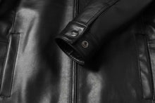 Load image into Gallery viewer, Close-up of genuine lambskin leather on REED men's jacket with stand-up collar, highlighting premium quality and design details.