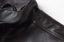 Load image into Gallery viewer, Close-up of black lambskin leather jacket with stand-up collar, showcasing premium craftsmanship and soft texture.