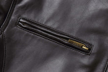 Load image into Gallery viewer, Close-up of a zippered pocket on a genuine lambskin leather men's jacket, highlighting the premium soft leather and craftsmanship.