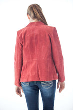 Load image into Gallery viewer, Back view of a woman wearing a red suede leather fashion jacket by REED, paired with jeans, showcasing stylish imported design.