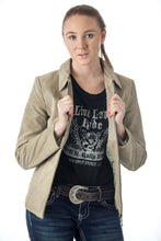 Load image into Gallery viewer, Woman wearing a beige suede leather jacket with a black graphic tee and jeans, showcasing a casual and stylish outfit.