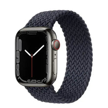 Load image into Gallery viewer, Nylon elastic loop strap for Apple Watch, compatible with iWatch Series 1-7, shown on watch face, black braided design.