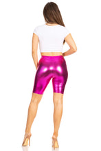 Charger l'image dans la galerie, Back view of person wearing shiny metallic pink bike shorts, showcasing stretchy fit and high-quality made in USA craftsmanship.