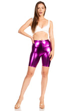 Charger l'image dans la galerie, Woman wearing shiny metallic purple bike shorts, stretchy and unisex, made in USA, showcasing fit and style.