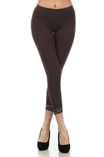 Load image into Gallery viewer, Woman wearing brown cotton blend lace trim stretch capri leggings, paired with black heels, showcasing stylish comfortable fit.