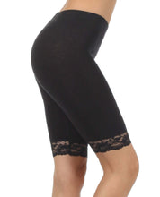 Charger l'image dans la galerie, Black cotton blend lace trim stretch bike shorts, side view, made in USA. Comfortable activewear with elegant lace detail.