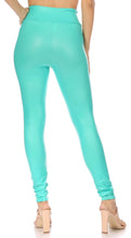 Load image into Gallery viewer, Woman modeling turquoise matte liquid high waist stretch leggings, back view, showcasing a sleek fit. Made in USA.