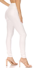 Load image into Gallery viewer, Side view of a model wearing white high waist stretch leggings with heels, showcasing the matte finish and tight fit. Made in USA.