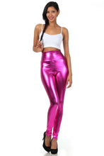 Charger l'image dans la galerie, Model wearing shiny liquid metallic high waist stretch leggings in bold pink, paired with white top and black heels, made in USA.
