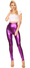 Charger l'image dans la galerie, Woman wearing shiny liquid metallic high-waist stretch leggings in purple, paired with a white crop top and heels, full body view.