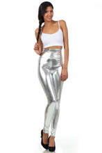 Charger l'image dans la galerie, Model wearing shiny liquid metallic high waist stretch leggings with white top, showcasing Sakkas bold color design, made in USA.