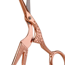 Load image into Gallery viewer, Close-up of ornate copper scissors with intricate detailing, partially open.