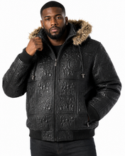 Cargar imagen en el visor de la galería, Man wearing Original Detroit High Roller Jacket by REED with unique embossed design and fur collar, showcasing style and luxury.