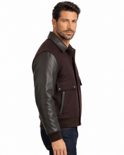 Load image into Gallery viewer, Man wearing REED leather varsity bomber jacket with wool body and leather sleeves, made in USA, classic and stylish design.