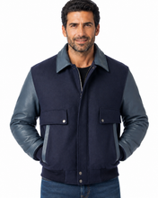 Load image into Gallery viewer, Man wearing REED leather varsity bomber jacket with wool body and leather sleeves, made in USA, classic and stylish design.