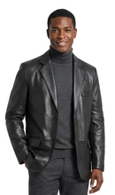 Charger l'image dans la galerie, Man wearing a black leather jacket over a gray suit on a white background