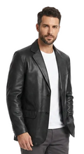 Charger l'image dans la galerie, Man wearing a black leather jacket, white shirt, gray pants, and white sneakers on a white background