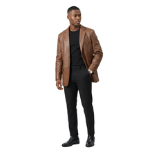 Load image into Gallery viewer, Man wearing a brown leather jacket and black pants on a white background