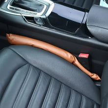 Load image into Gallery viewer, Brown PU leather seat gap filler in car, preventing items from slipping, made of vegan leather for a tidy and luxurious ride.