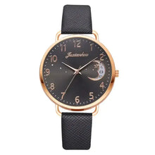 Cargar imagen en el visor de la galería, Elegant moon-themed watch with dark face, gold markers, and black leather strap, perfect for adding celestial charm to any outfit.