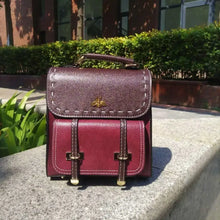 Cargar imagen en el visor de la galería, Bumblebee vegan leather backpack in the sun, showcasing maroon color and elegant design for professionals.
