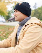 Charger l'image dans la galerie, Man wearing NEW HAAKWEAR H-Stitch Cuffed Beanie - Designed and Made in USA (Patented Design) - Charcoal Black outdoors in fall