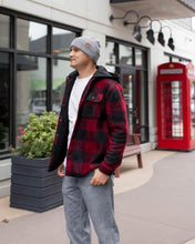 Load image into Gallery viewer, Person wearing NEW HAAKWEAR H-Stitch Cuffed Beanie - Designed and Made in USA (Patent Pending Design) - Koala Gray in urban setting.