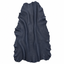 Cargar imagen en el visor de la galería, Navy sheepskin hide over a white background