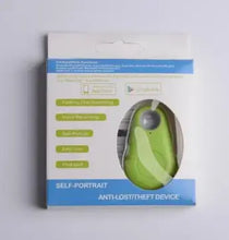 Load image into Gallery viewer, Green GPS tracker in packaging, labeled self-portrait anti-lost device, ideal for tracking items, pets, and loved ones.